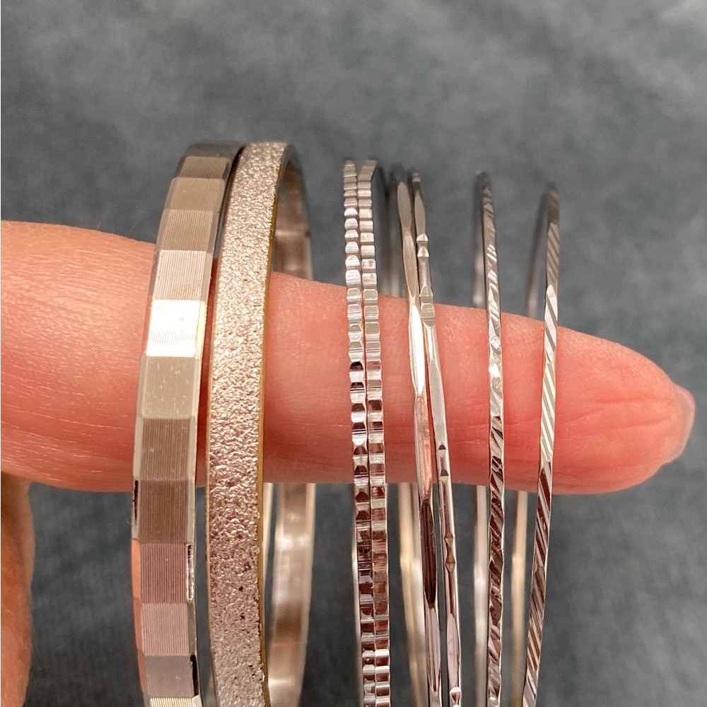 Lot of 8 Silver Tone Vintage Bangles . MONET.  Size “ S “ Various. Designs READ